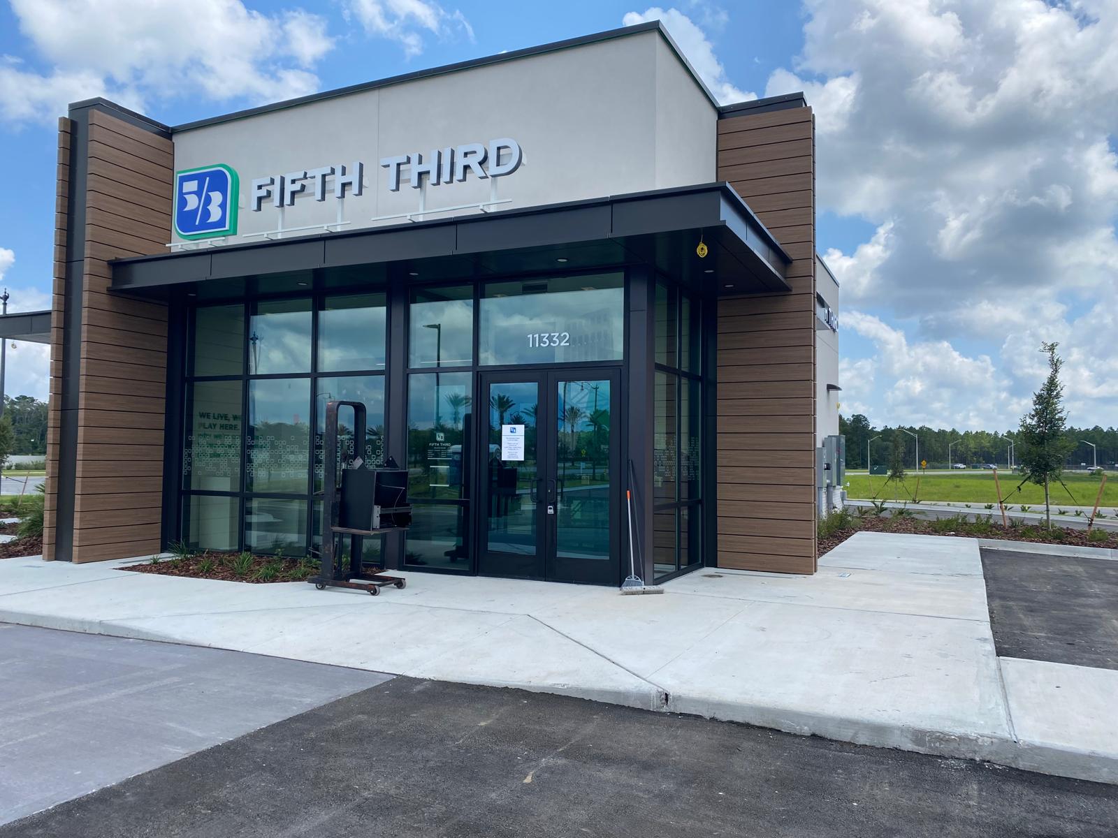 Aluminum storefront system with a pair of entrance doors.